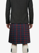 Person wearing a dark jacket and red plaid kilt on a white background