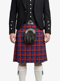 Person wearing a black jacket with silver buttons and a red and blue plaid kilt on a white background