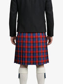 Person wearing a black jacket and red and blue plaid kilt on a white background