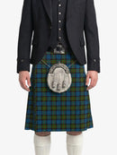Person wearing a traditional Scottish kilt with a tartan pattern on a white background