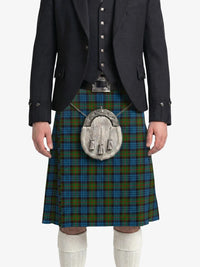 Person wearing a traditional Scottish kilt with a tartan pattern on a white background