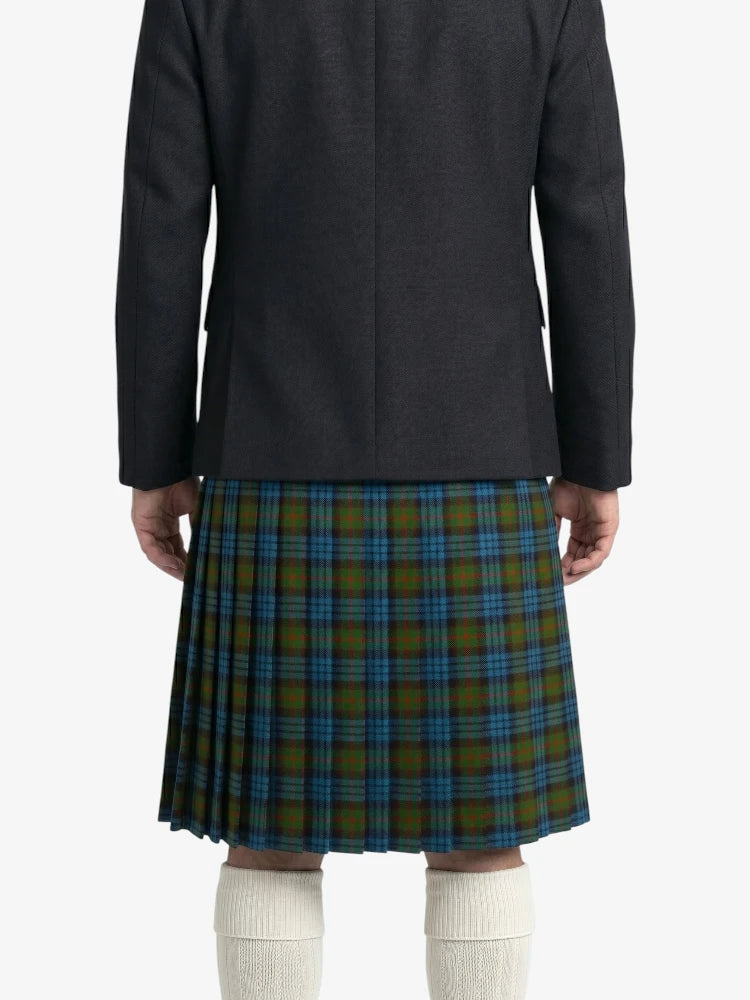 Person wearing a dark jacket and plaid kilt on a white background