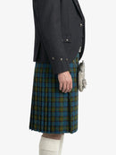 Person wearing a dark gray jacket  and plaid kilt on a white background