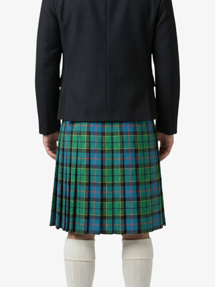 Person wearing a dark jacket and green plaid kilt on a white background