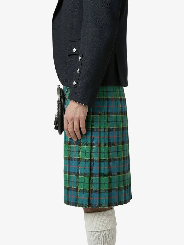 Person wearing a dark jacket and green plaid kilt on a white background