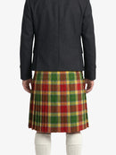 Person wearing a black jacket and a red, green, and brown plaid kilt on a white background