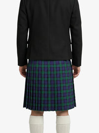 Person wearing a black coat and a green and purple plaid kilt on a white background