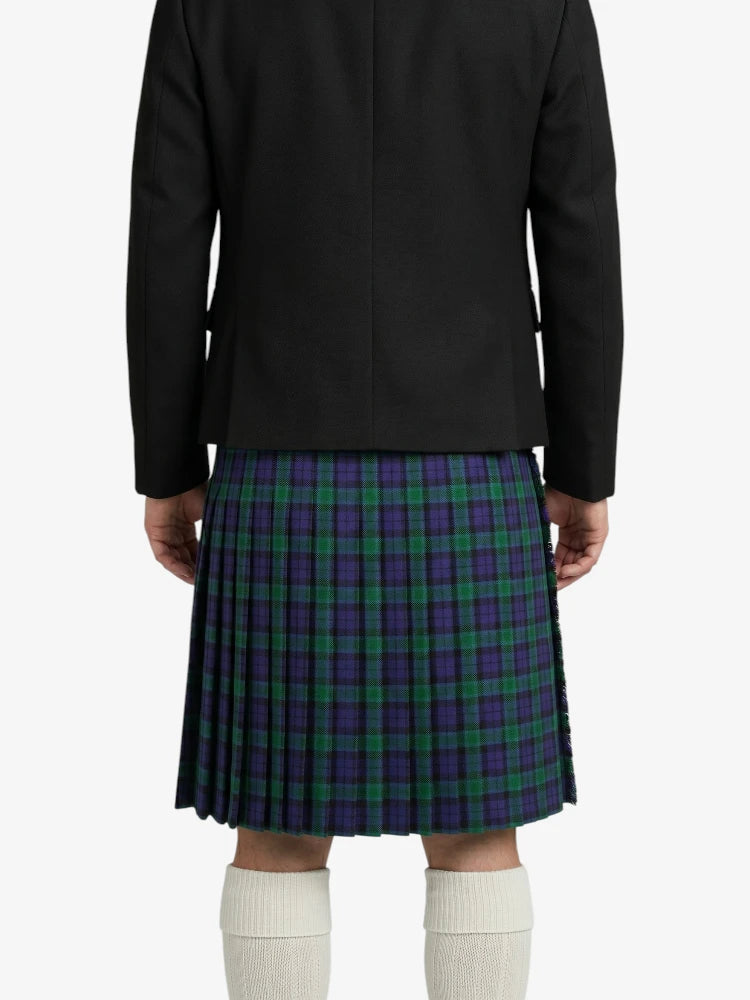 Person wearing a black coat and a green and purple plaid kilt on a white background