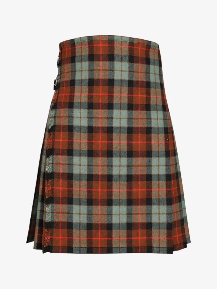 Plaid kilt with red, green, and black pattern on a white background