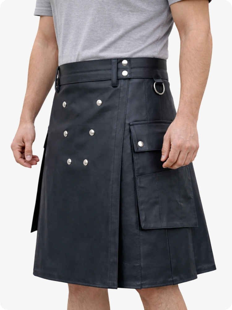 Person wearing a black kilt with silver buttons on a white background