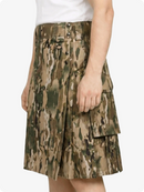 Camouflage skirt worn by a person on a white background