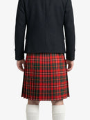 Person wearing a black coat and red plaid kilt on a white background