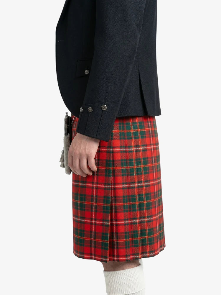Person wearing a black jacket and red plaid kilt on a white background