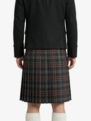 Person wearing a black coat and plaid kilt on a white background