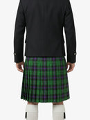 Person wearing a black jacket and green plaid kilt on a white background