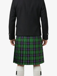 Person wearing a black jacket and green plaid kilt on a white background