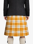 Person wearing a black jacket and yellow plaid kilt on a white background