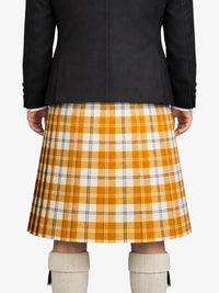 Person wearing a black jacket and yellow plaid kilt on a white background