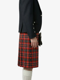 Person wearing a dark jacket and red plaid kilt on a white background