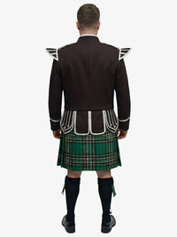 Person wearing a traditional Scottish irish national tartan kilt with a dark brown jacket on a white background