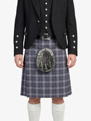 Person wearing a traditional Scottish kilt with a sporran on a white background