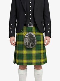 Person wearing a green and yellow plaid kilt with a black jacket on a white background