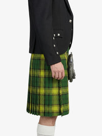 Person wearing a green plaid kilt with a black jacket on a white background