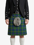 Person wearing a traditional Scottish kilt with a tartan pattern on a white background