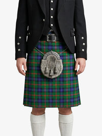 Person wearing a traditional Scottish kilt with a tartan pattern on a white background