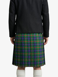 Person wearing a black jacket and plaid kilt on a white background