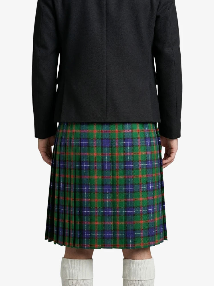 Person wearing a black jacket and plaid kilt on a white background