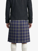 Person wearing a dark gray jacket and plaid kilt on a white background 