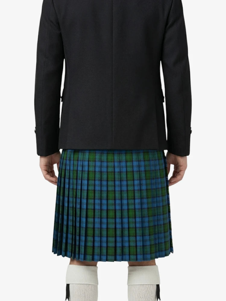 Person wearing a black jacket and green plaid kilt on a white background