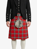 Person wearing a red tartan kilt with a black jacket on a white background
