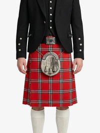 Person wearing a red tartan kilt with a black jacket on a white background
