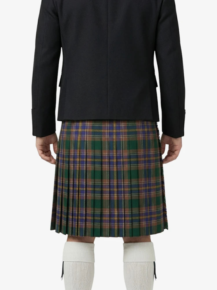 Person wearing a black jacket and plaid kilt on a white background