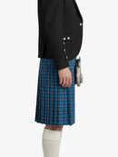 Person wearing a black jacket and blue plaid kilt on a white background