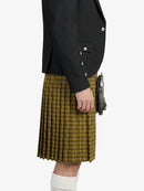 Person wearing a black jacket and yellow plaid kilt on a white background