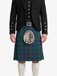 Person wearing a traditional Scottish kilt with a tartan pattern on a white background