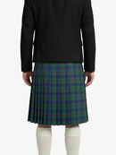 Person wearing a black jacket and green plaid kilt on a white background