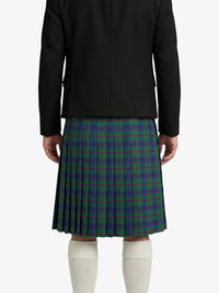 Person wearing a black jacket and green plaid kilt on a white background
