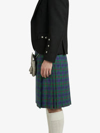 Person wearing a black jacket and green plaid kilt on a white background