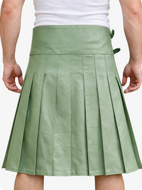 Green pleated skirt worn by a person on a white background