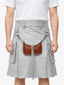 Person wearing a Light gray Leather Kilt with a brown leather bag attached
