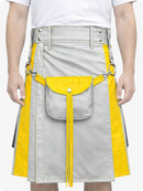 Person wearing a light gray and yellow kilt with visible buttons and fringes.