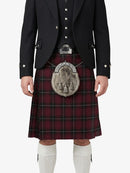 Person wearing a traditional Scottish kilt with a tartan pattern on a white background
