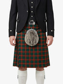 Person wearing a traditional Scottish kilt with a tartan pattern on a white background