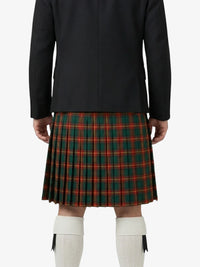 Person wearing a black coat and green plaid kilt on a white background