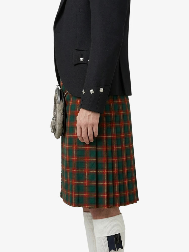 Person wearing a black jacket and green plaid kilt on a white background
