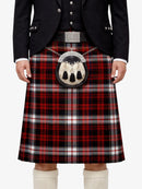 Person wearing a traditional Scottish kilt with a plaid pattern on a white background